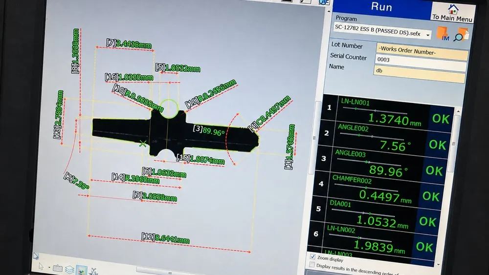 Automated dimensional measurement readout showing pass results for a part