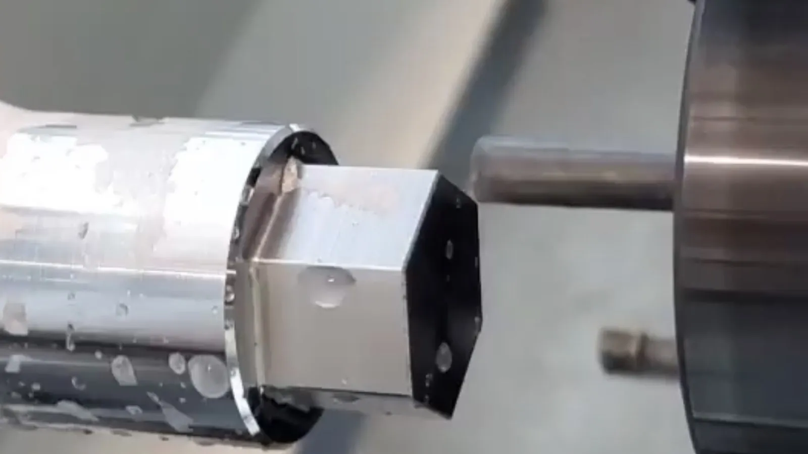 Live CNC turning with cutting tool and coolant at Brassland