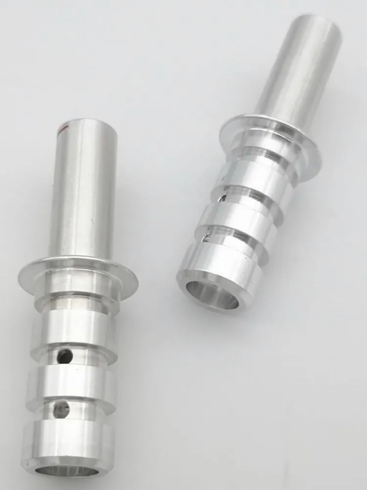 CNC-turned aluminium spindle components by Brassland