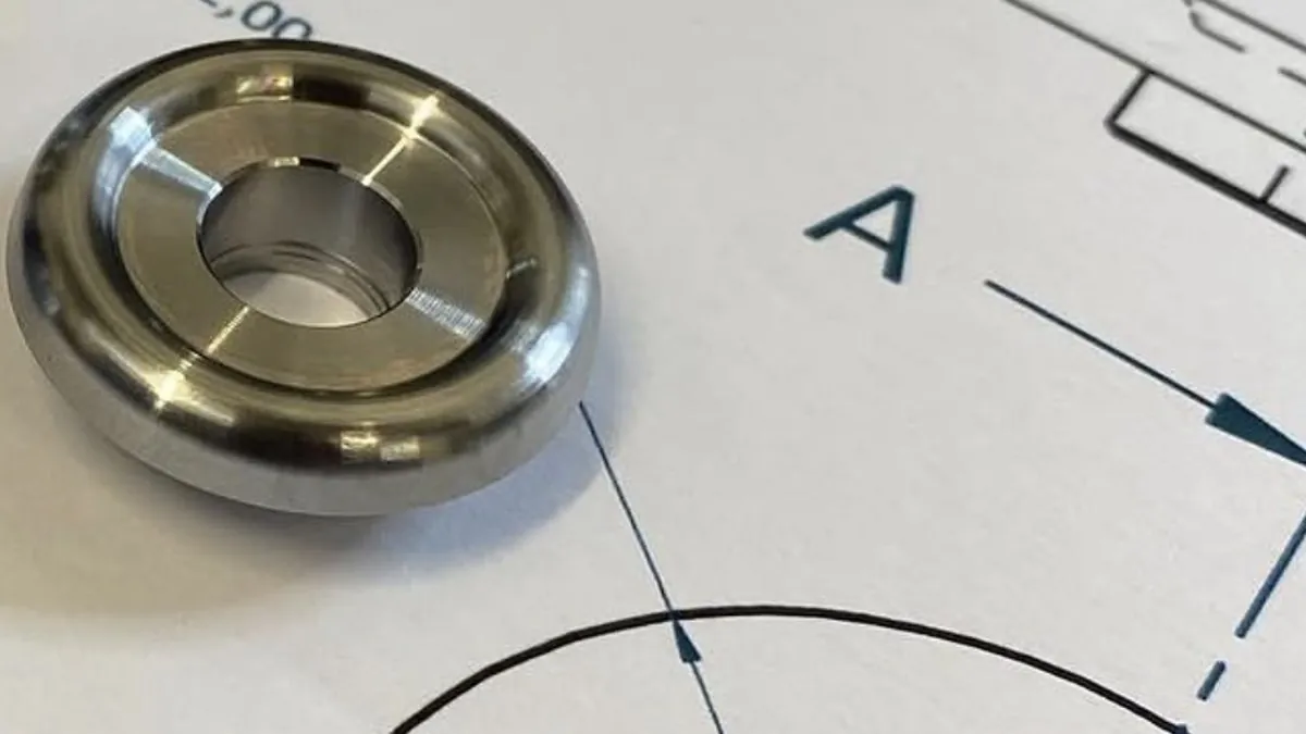 Precision machined flanged bushings shown on a dimensioned engineering drawing