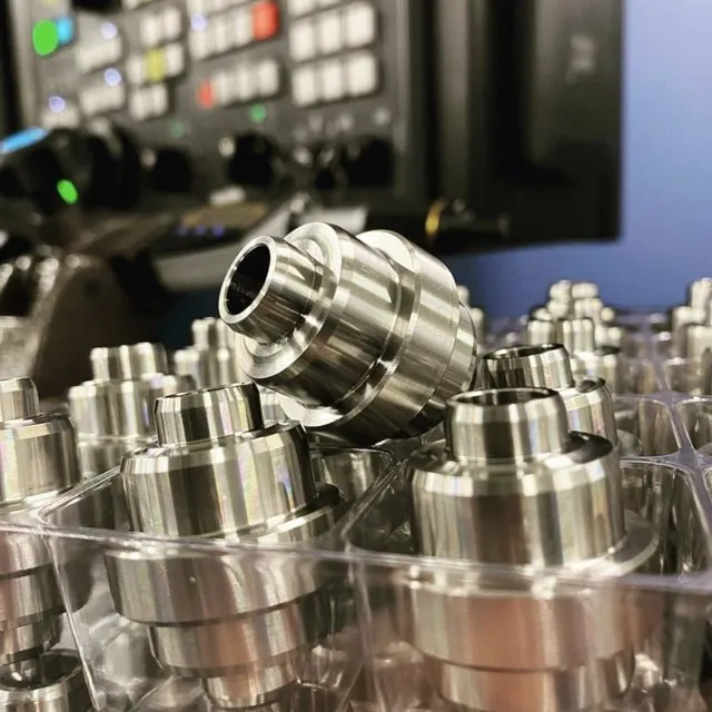 Flanged metal components being machined on a CNC centre