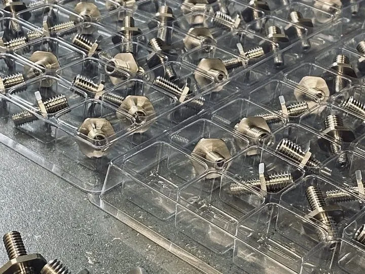Batch of CNC turned brass components in multiple alloys — Brassland alloy selection