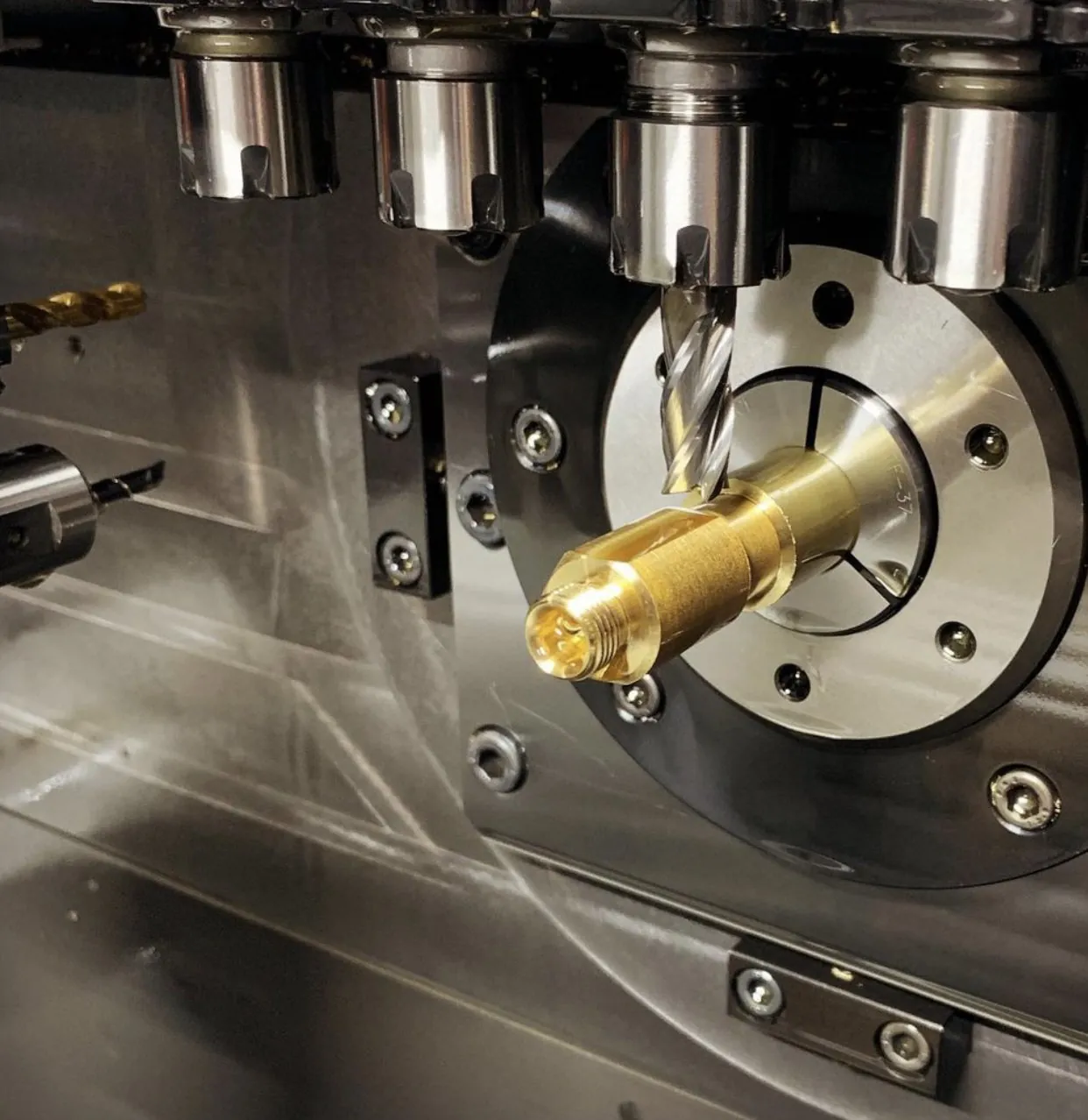 Multi-axis CNC machining a brass component in production at Brassland, Jamnagar