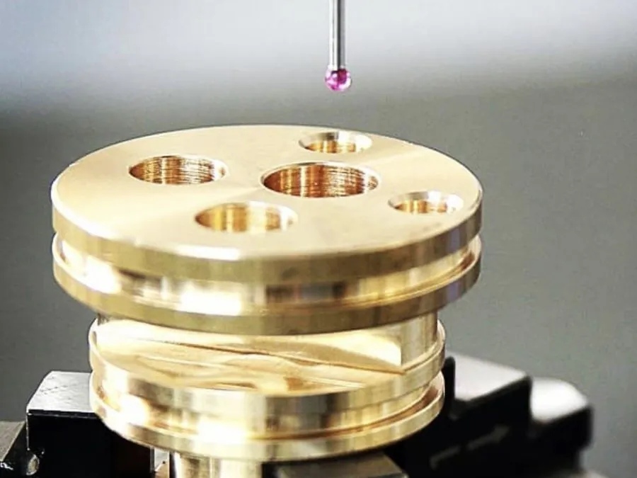 CMM ruby touch probe inspecting a machined brass component on a fixture at Brassland