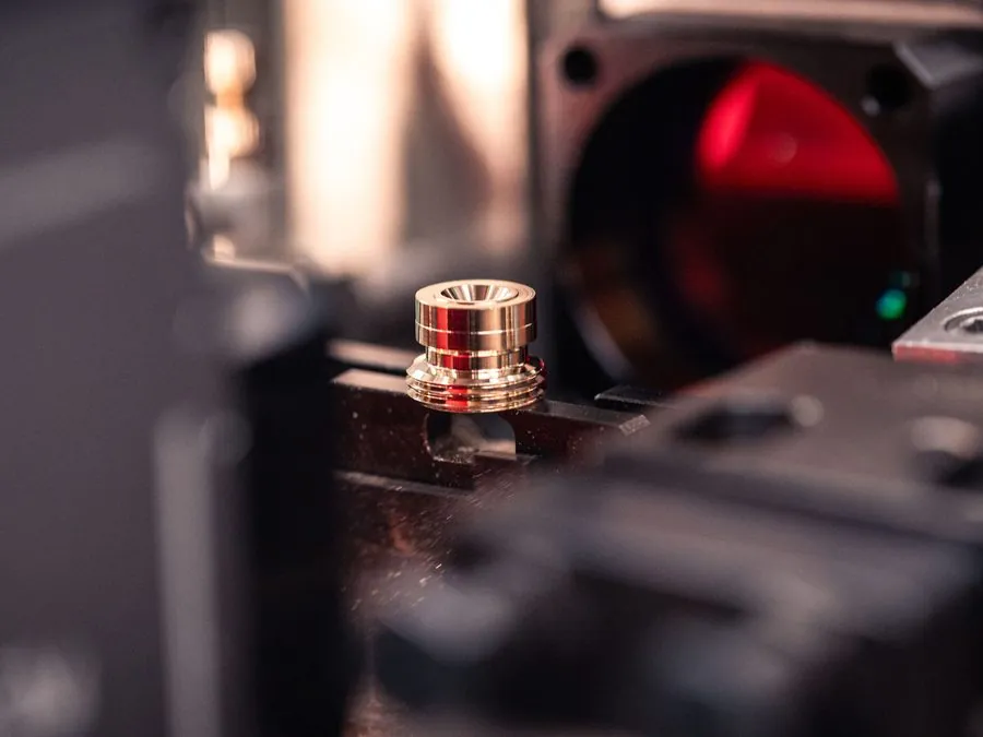 Precision brass part under optical form measurement with laser alignment at Brassland