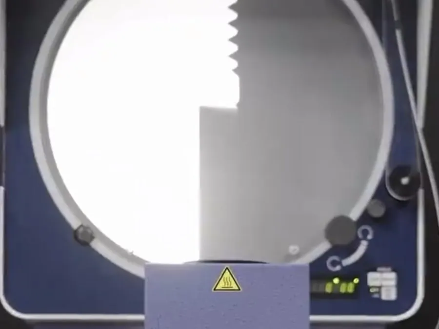Mitutoyo profile projector displaying the magnified thread profile of a brass part at Brassland
