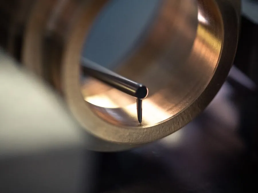 Roundness tester stylus measuring circularity inside the bore of a brass ring at Brassland