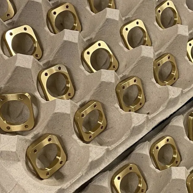 Tray of brass flanged machined parts